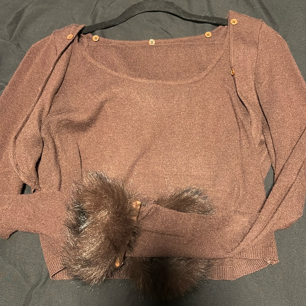 A two piece long sleeve and skirt brown